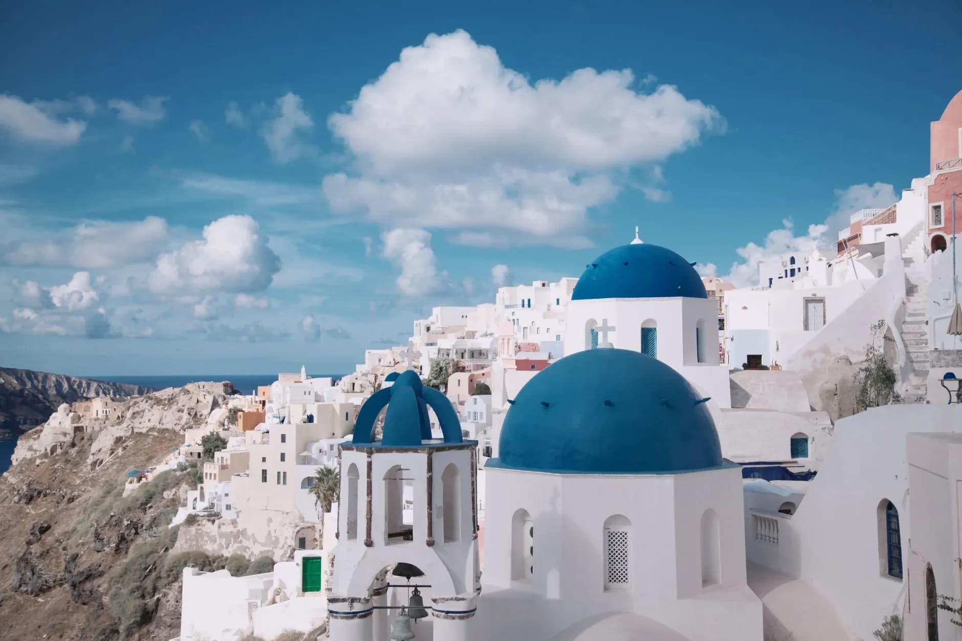Blue-domed churches above the caldera in Oia, Santorini, Greece