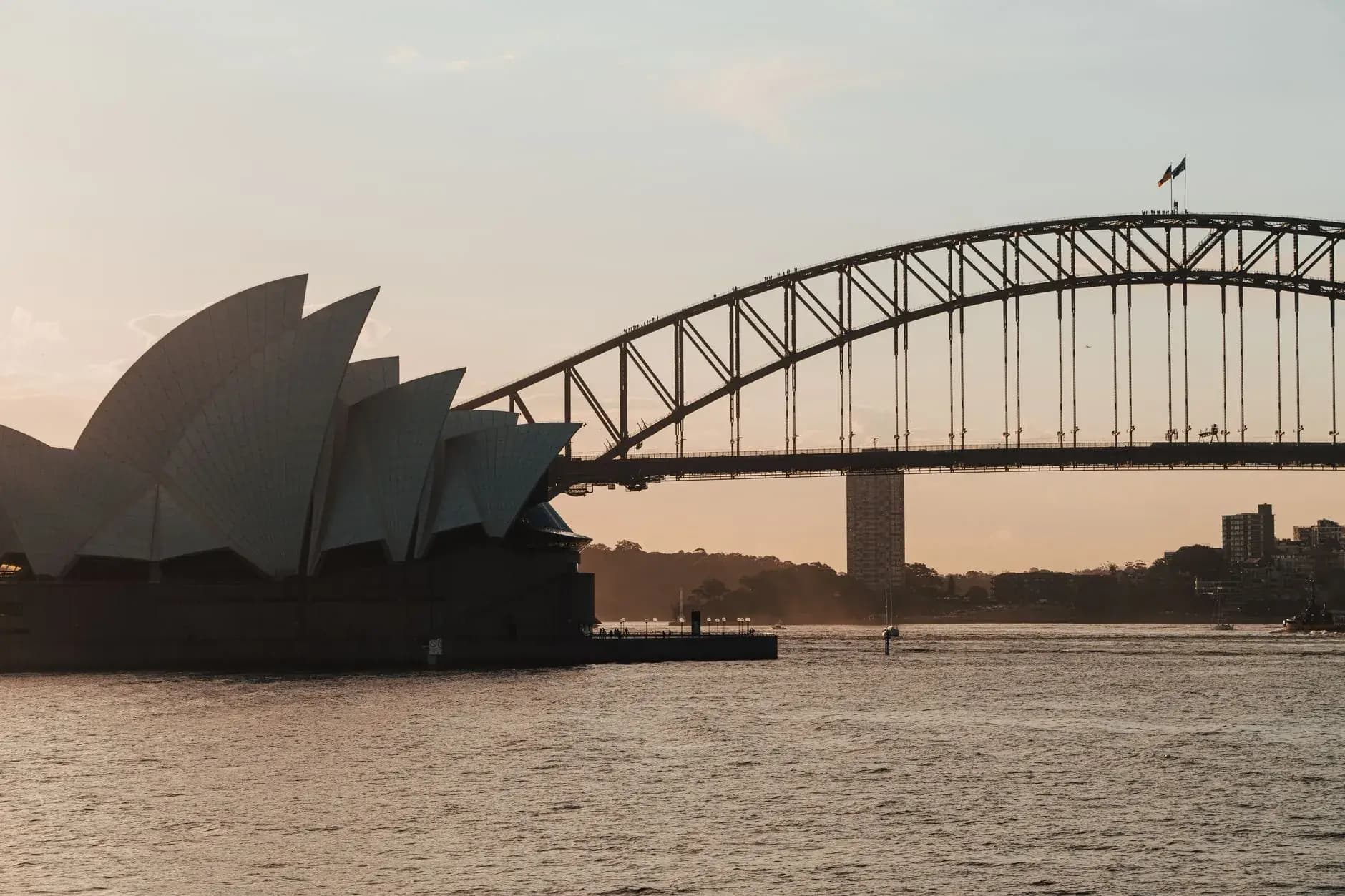 Sydney Harbor with the Opera House and bridge at dusk on a luxury private Australia tour