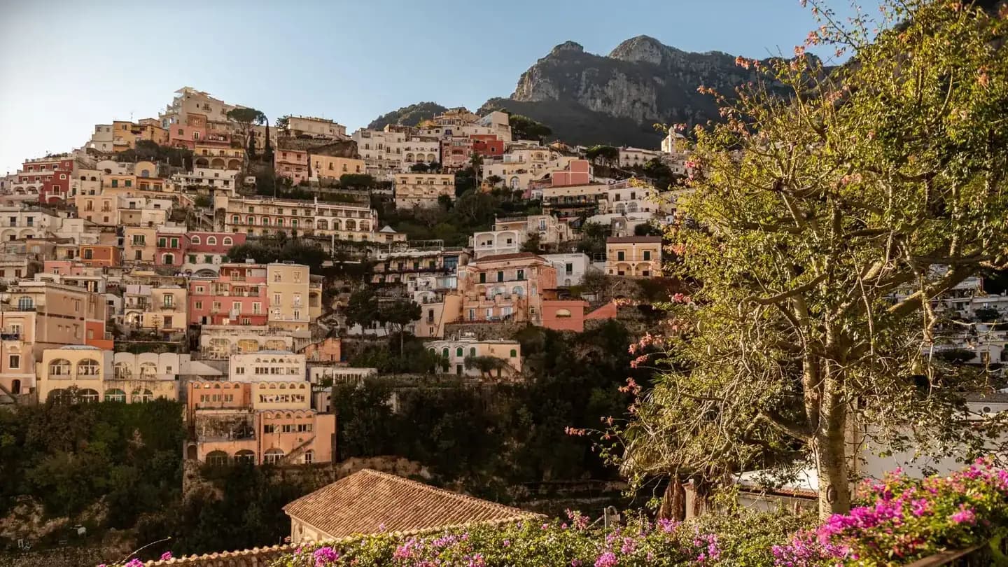 Pastel houses of Positano cascading to the sea on a luxury Amalfi Coast tour