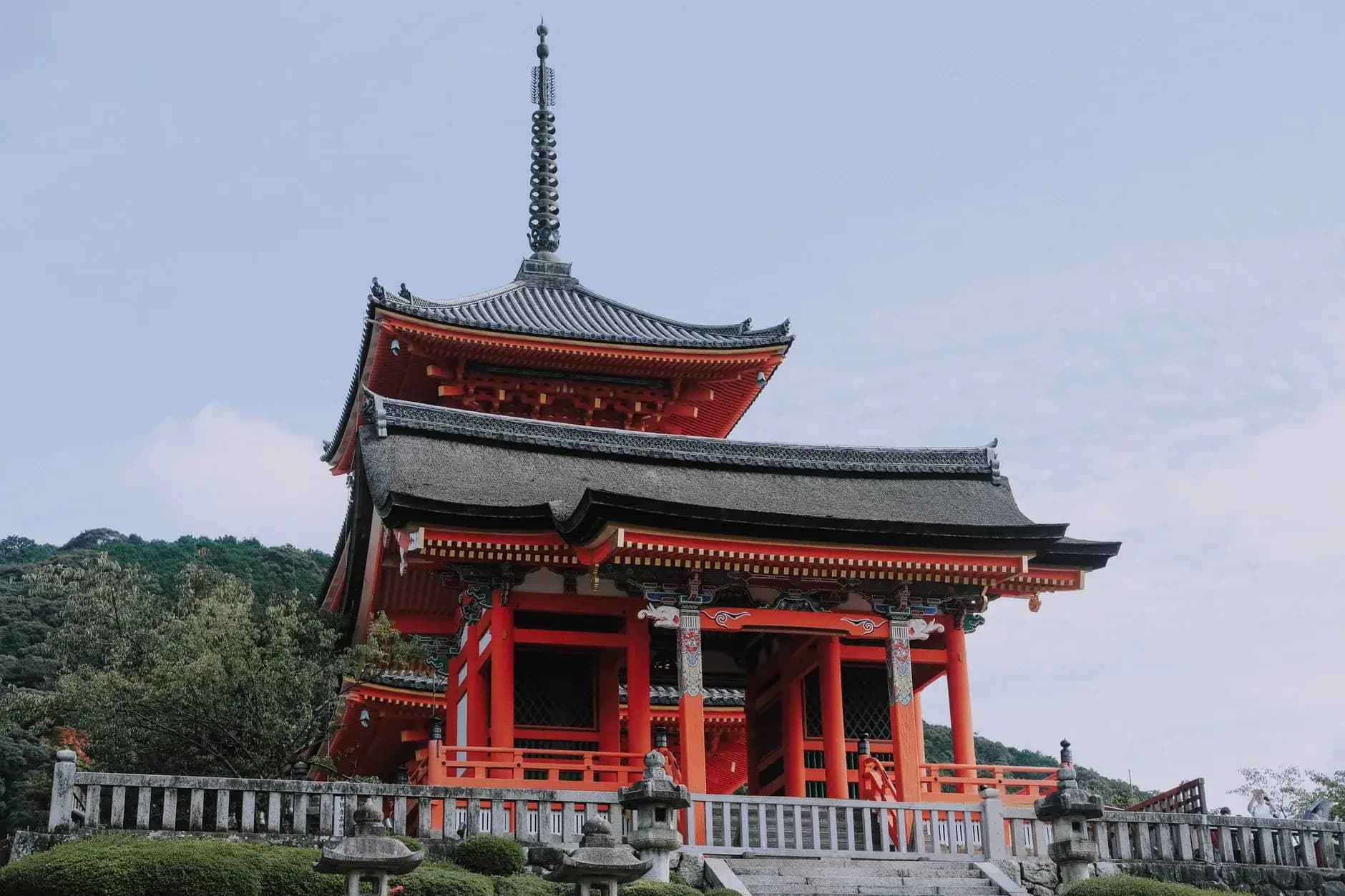 Traditional temple pagoda in Kyoto surrounded by maple trees on a private Asia tour