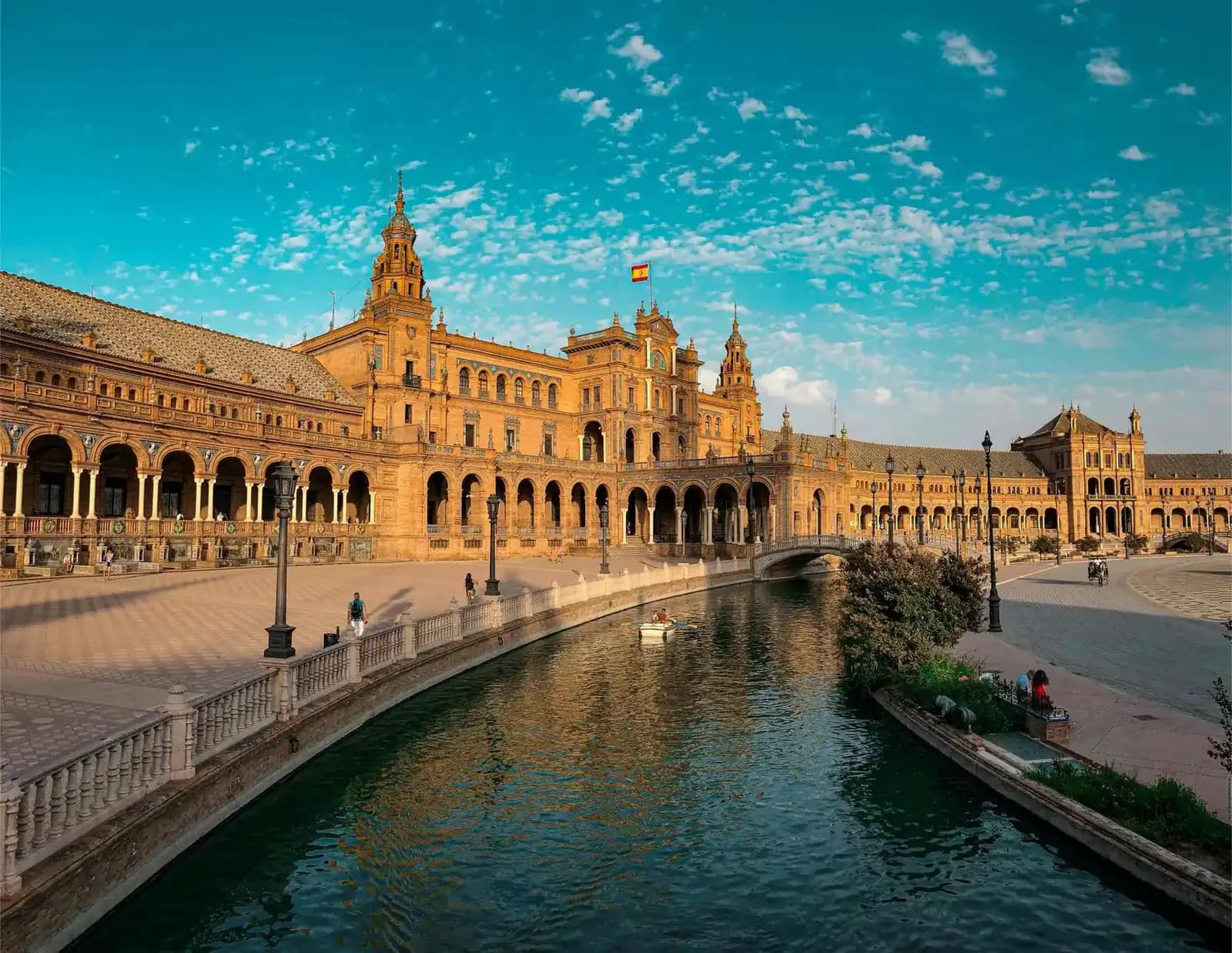 Plaza de España in Seville with its tiled bridges and turquoise sky on a private Spain tour